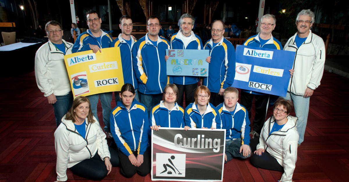 Heather Roberts poses for a photo with Team Alberta curlers in 2006.