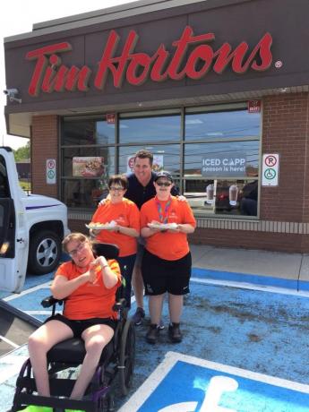 A picture of Heather Miller and other Special Olympics athletes at a Tim Hortons on Day of Inclusion last year.
