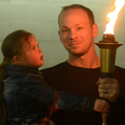 Mike and Kelsey hold the Flame of Hope