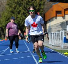 Jesse Thibeault running on track