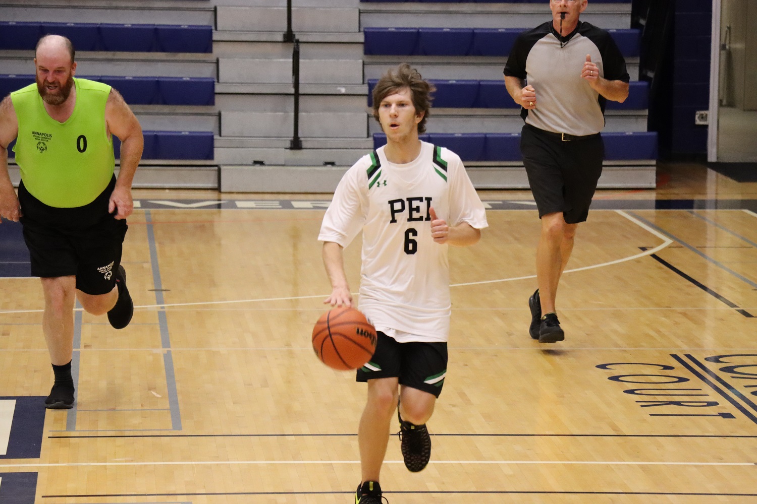 Team PEI 2026 Basketball athlete, Zachary Hebert, dripples the basketball down the court
