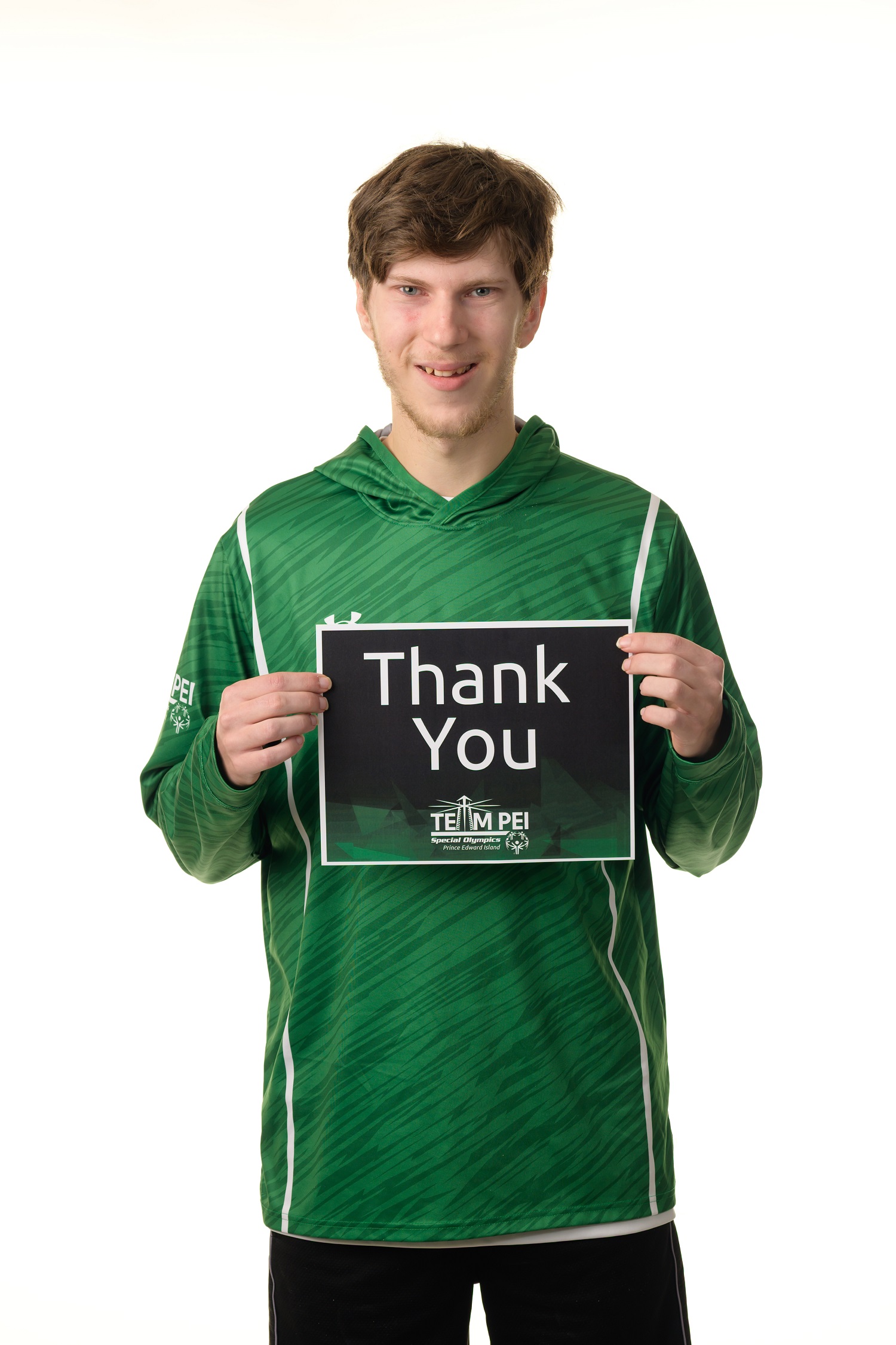 Team PEI 2026 Basketball athlete, Zachary Hebert, holding a thank you sign