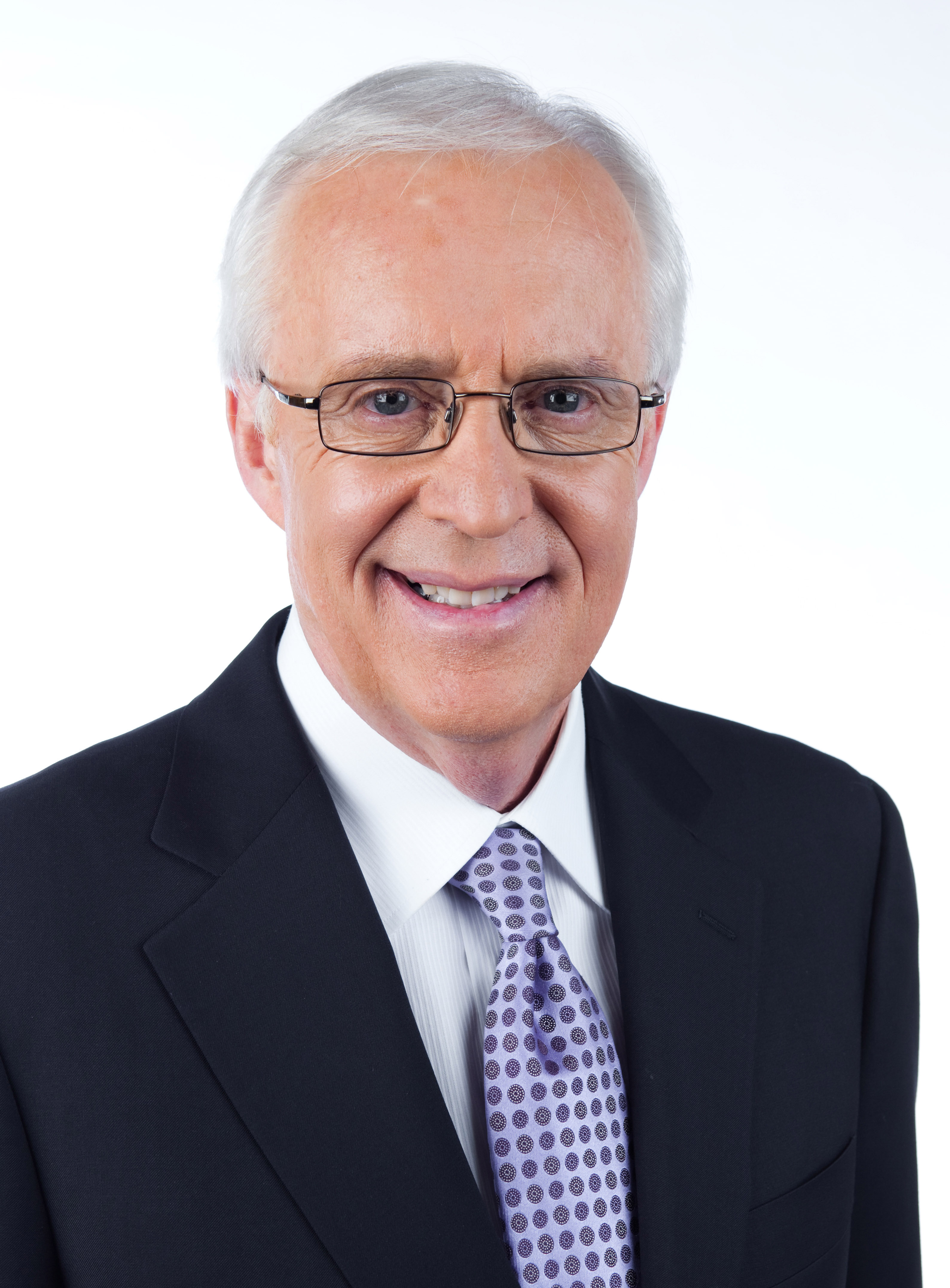 Headshot of a man wearing a suit Headshot of a man wearing a suit