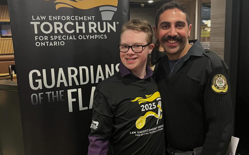Gage and an Officer at the Law Enforcement Torch Run. 