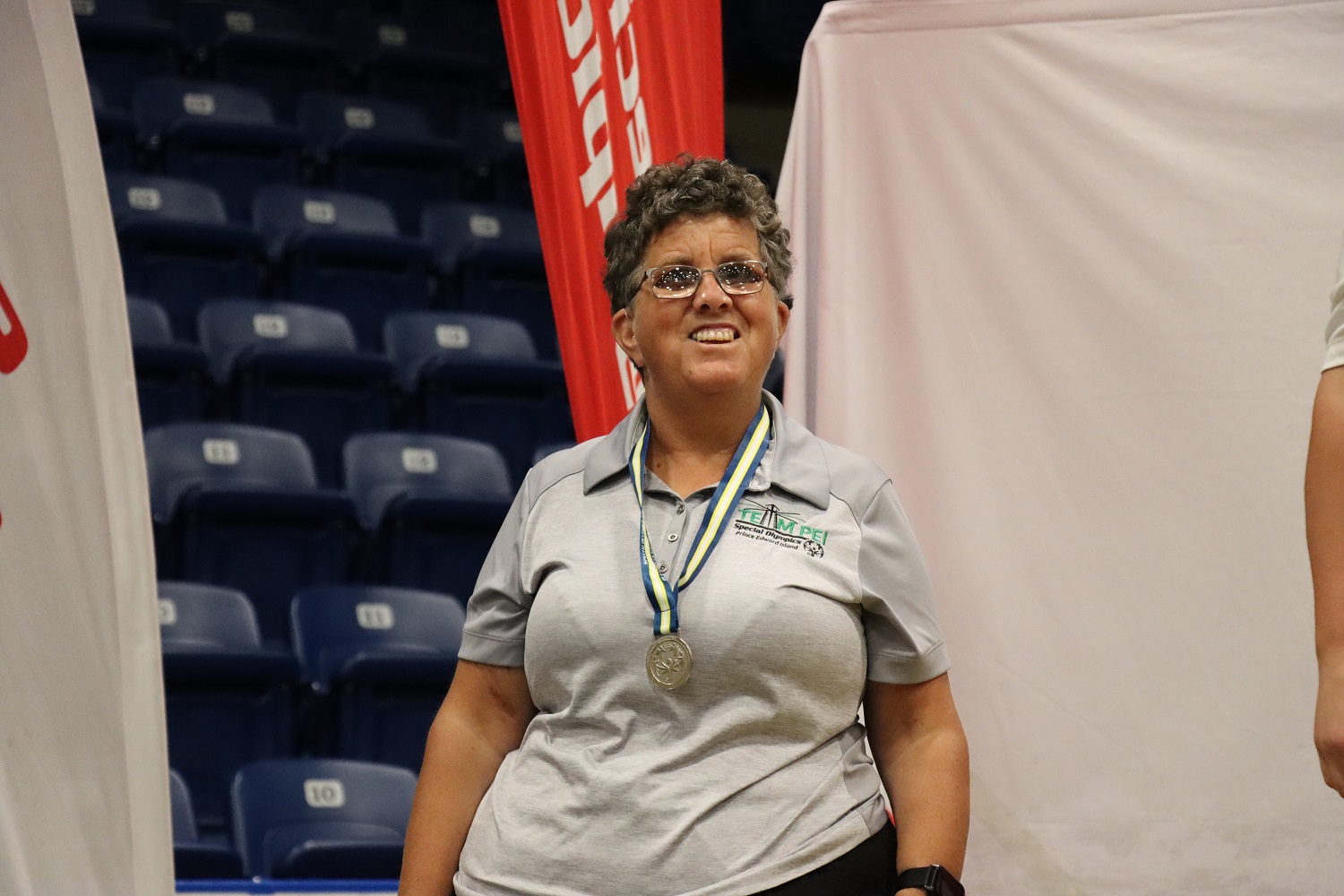 Team PEI 2026 Golf athlete, Heidi Mallett, standing on a podium with a medal