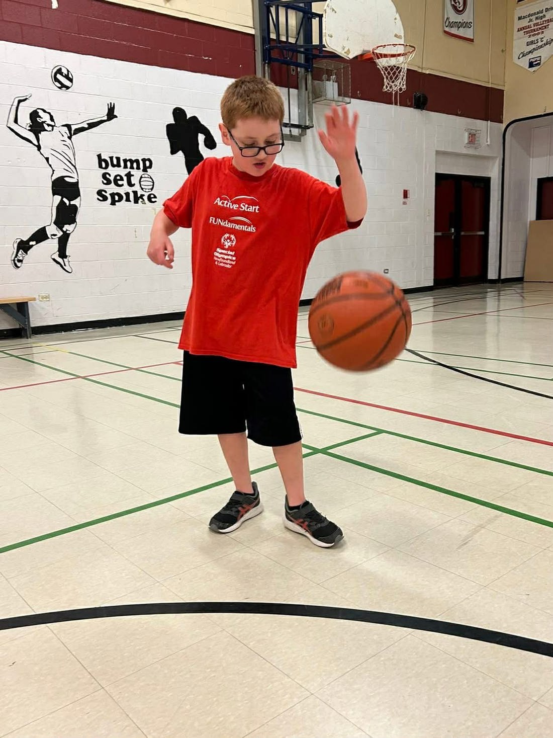 Alexander playing basketball 