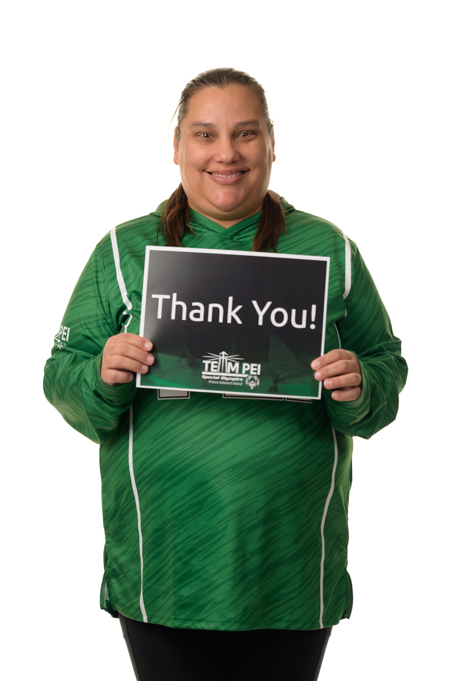 Team PEI 2026 Swimming athlete, Sarah Halman, standing with a thank you sign