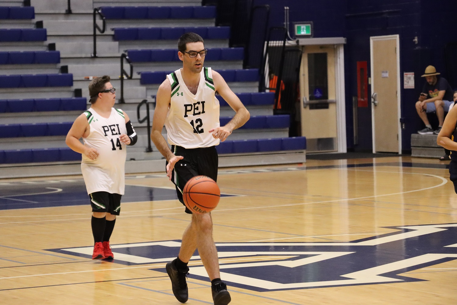 Team PEI 2026 Basketball athlete, Conner Arsenault, dripples the basketball down the court