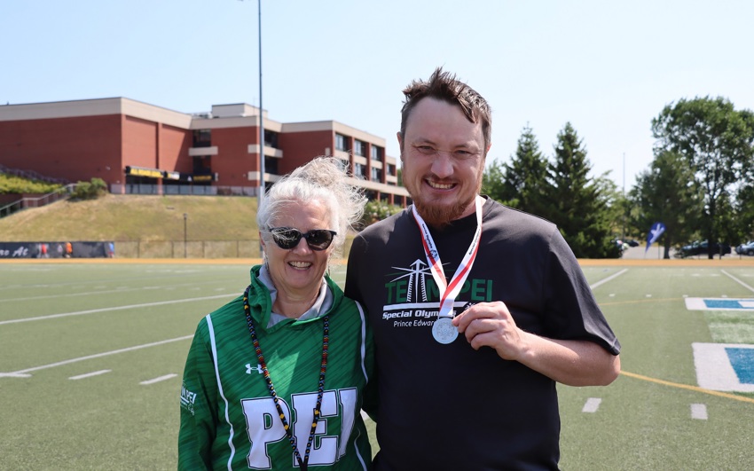 Special Olympics PEI, Athlete with Volunteer, Athletics, Athlete with Medal