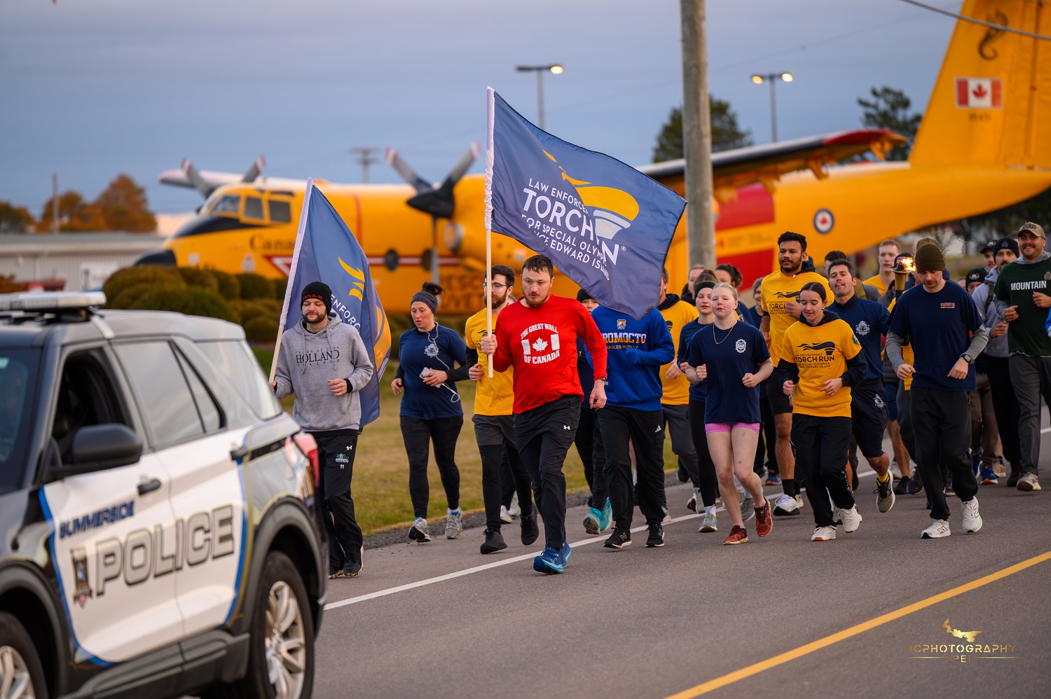 Athletes and Law Enforcement officers participating in the Torch Run for Special Olympics Athletes and Law Enforcement officers participating in the Torch Run for Special Olympics