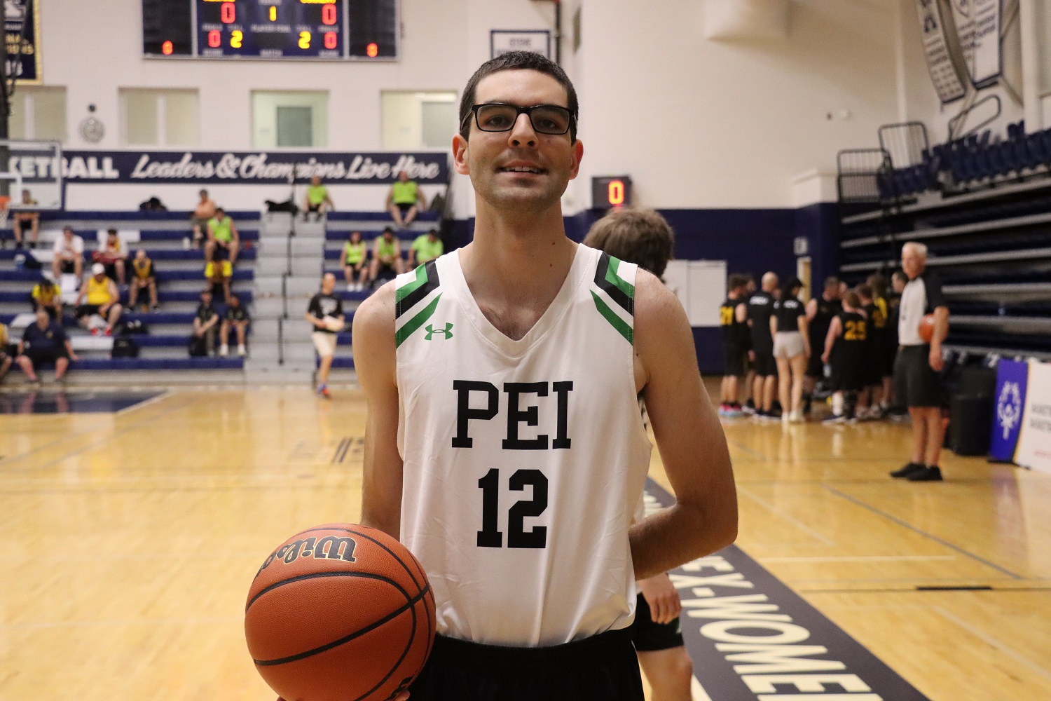 Team PEI 2026 Basketball athlete, Conner Arsenault, holding a basketball on the court