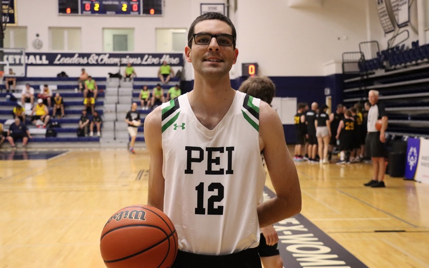 Team PEI 2026 Basketball athlete, Conner Arsenault, holding a basketball on the court