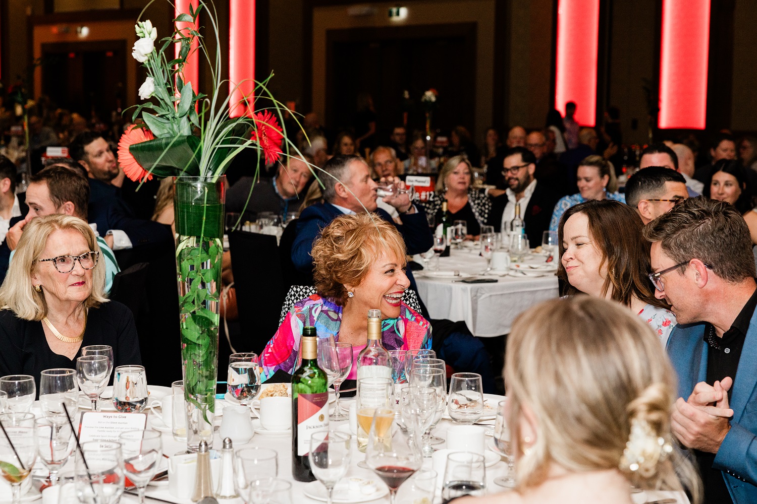 Long time Special Olympics PEI Enriching Lives Gala Committee volunteer, Betty Anne Morrison at a dinner table with other guests
