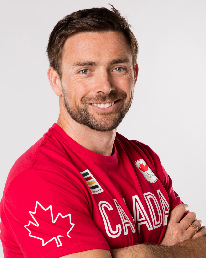 Headshot of a man in a red Canada tshirt. Headshot of a man in a red Canada tshirt.