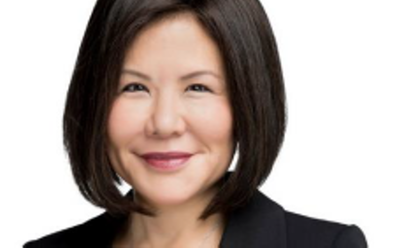 Woman with dark hair wearing a black blazer. 