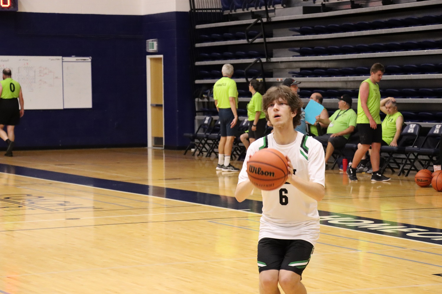Team PEI 2026 Basketball athlete, Zachary Hebert, holding a basketball, preparing to take a shot on net