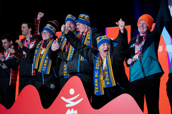 A group of Special Olympics BC athletes show excitement and joy as they receive their medals at the 2024 Special Olympics Canada National Winter Games in Calgary.