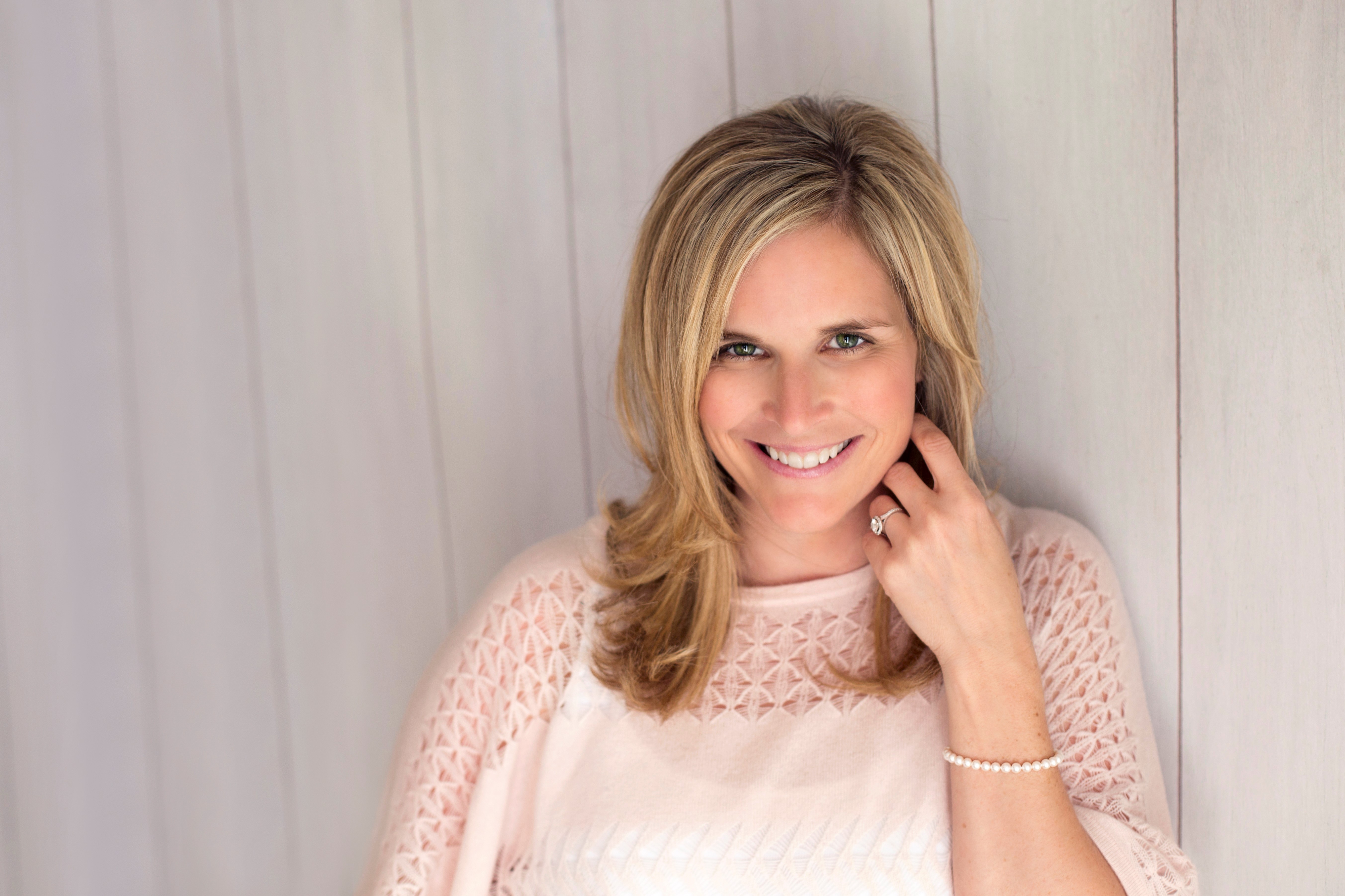 Portrait of a women with long blond hair wearing a white sweater. Portrait of a women with long blond hair wearing a white sweater.