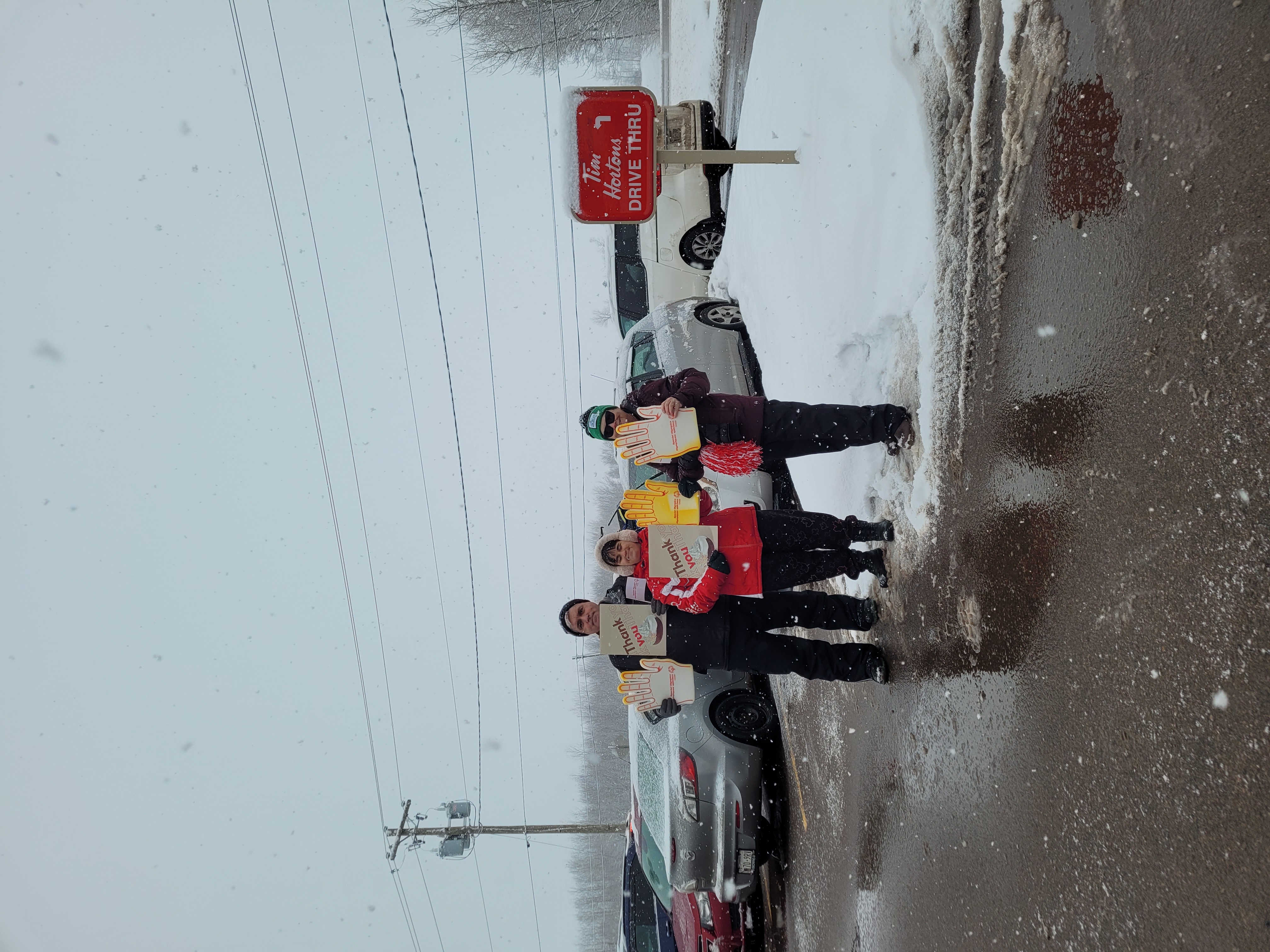 Special Olympic Donut Ambassadors promoting the Special Olympics Donut at Tim Hortons