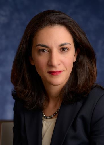 Image of a woman's face with long dark hair. 
