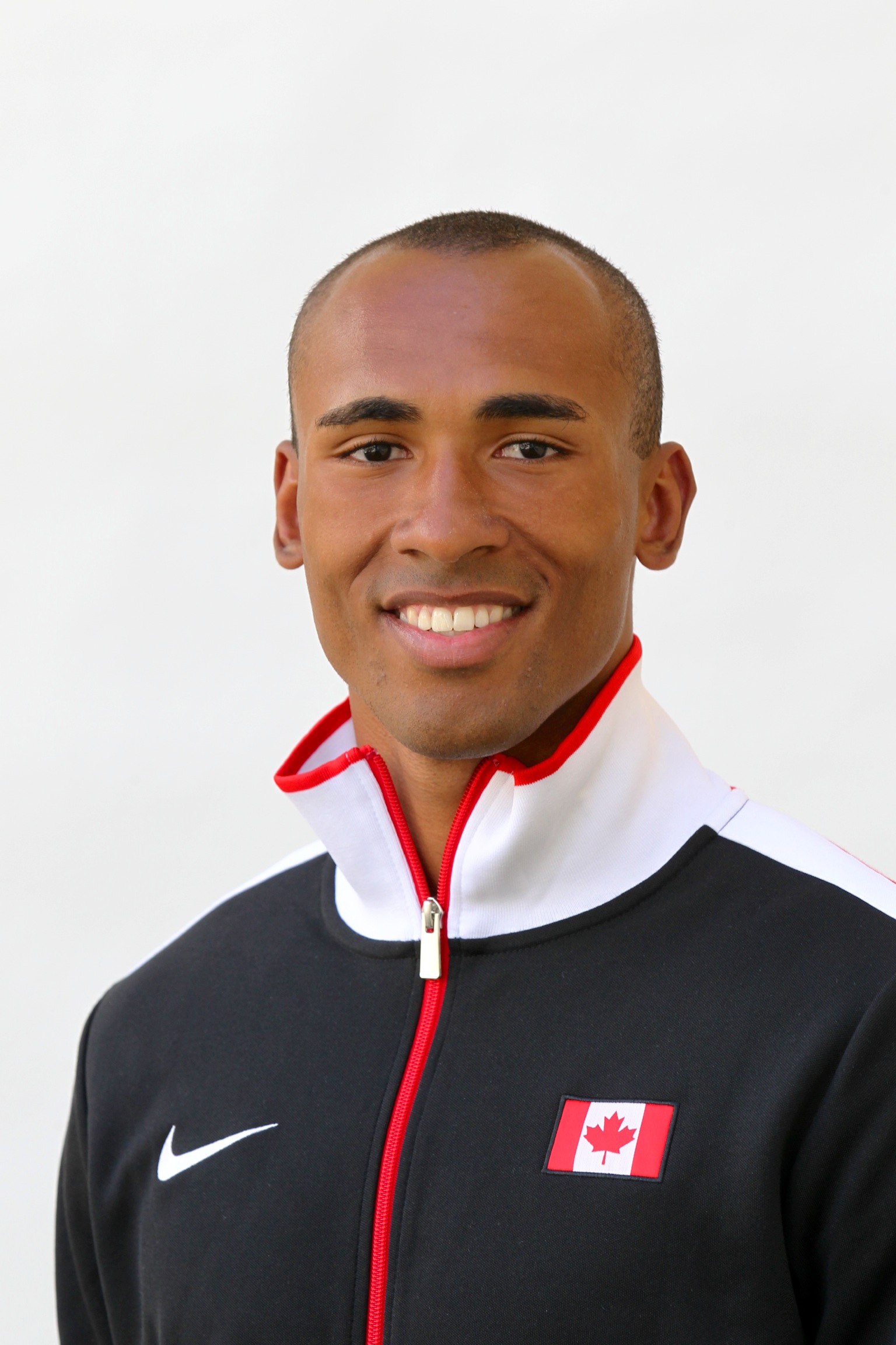 Headshot of a man in a zip up sport sweater with the Canadian flag on it. Headshot of a man in a zip up sport sweater with the Canadian flag on it.