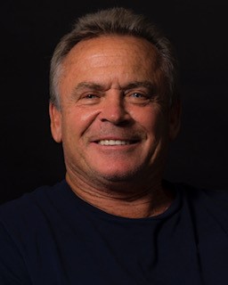 Headshot of a man in black tshirt Headshot of a man in black tshirt