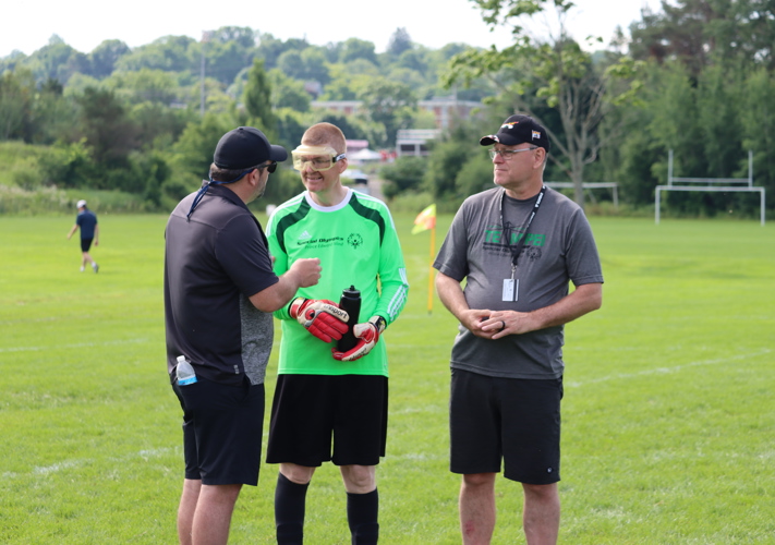Special Olympics PEI, Soccer, 2 Coaches with Athlete