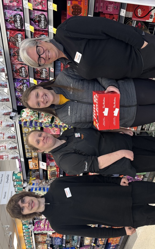 Lisa Murphy with coworkers at Lawtons Drugs.