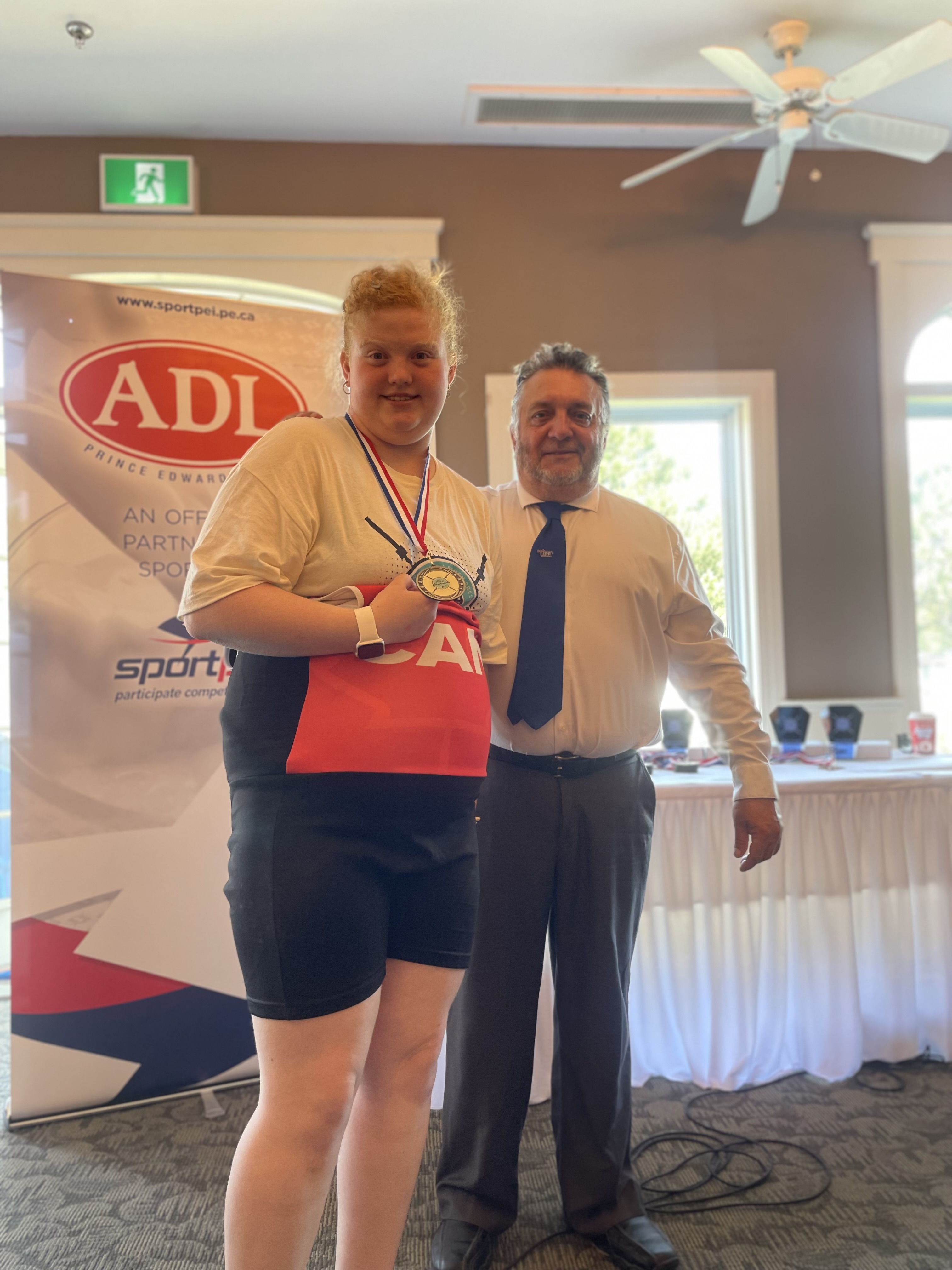 Special Olympics PEI, Powerlifting, Athlete with Medal