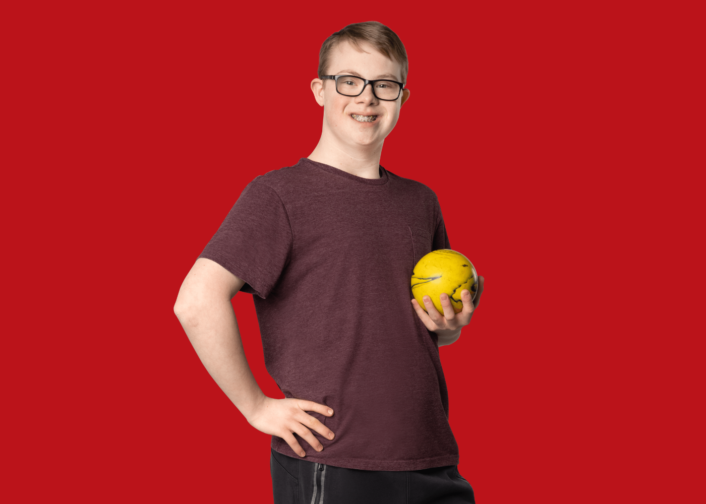 Gage Mechefske with red background.
