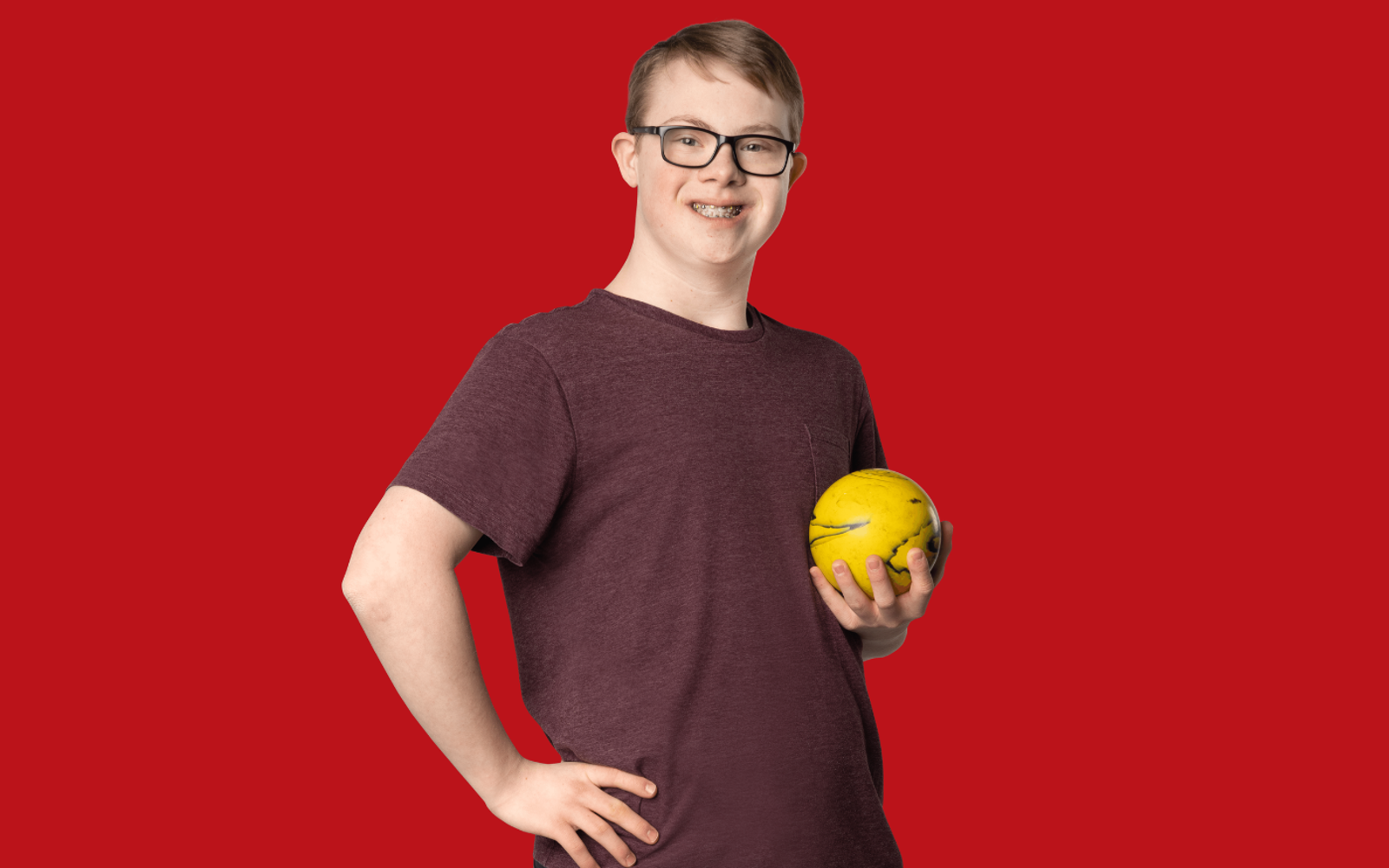 Gage Mechefske with red background.