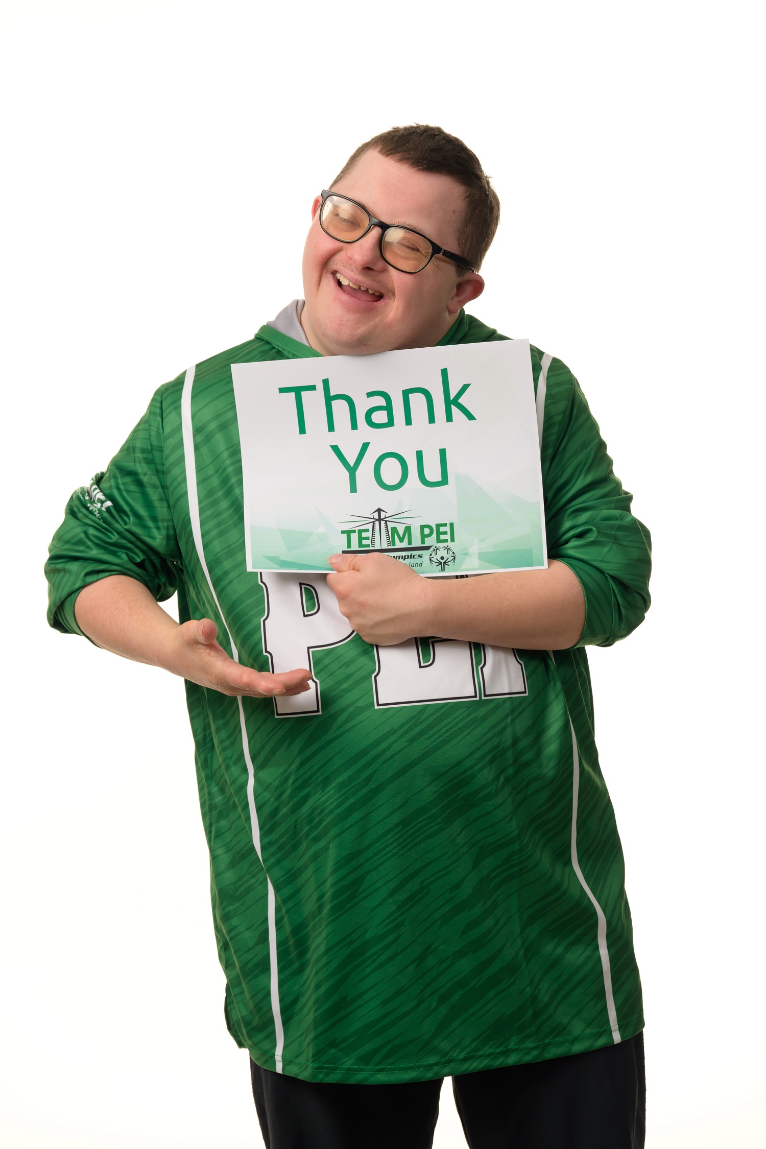 Team PEI 2026 Golf athlete, Colton Matheson, with a thank you sign