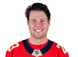 Headshot of a Man in a hockey jersey Headshot of a Man in a hockey jersey