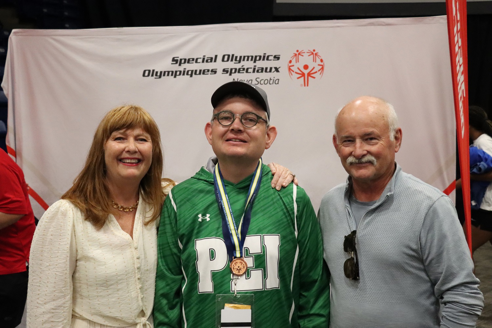 Special Olympics PEI, Golf, Athlete with Medal, Athlete with Parents