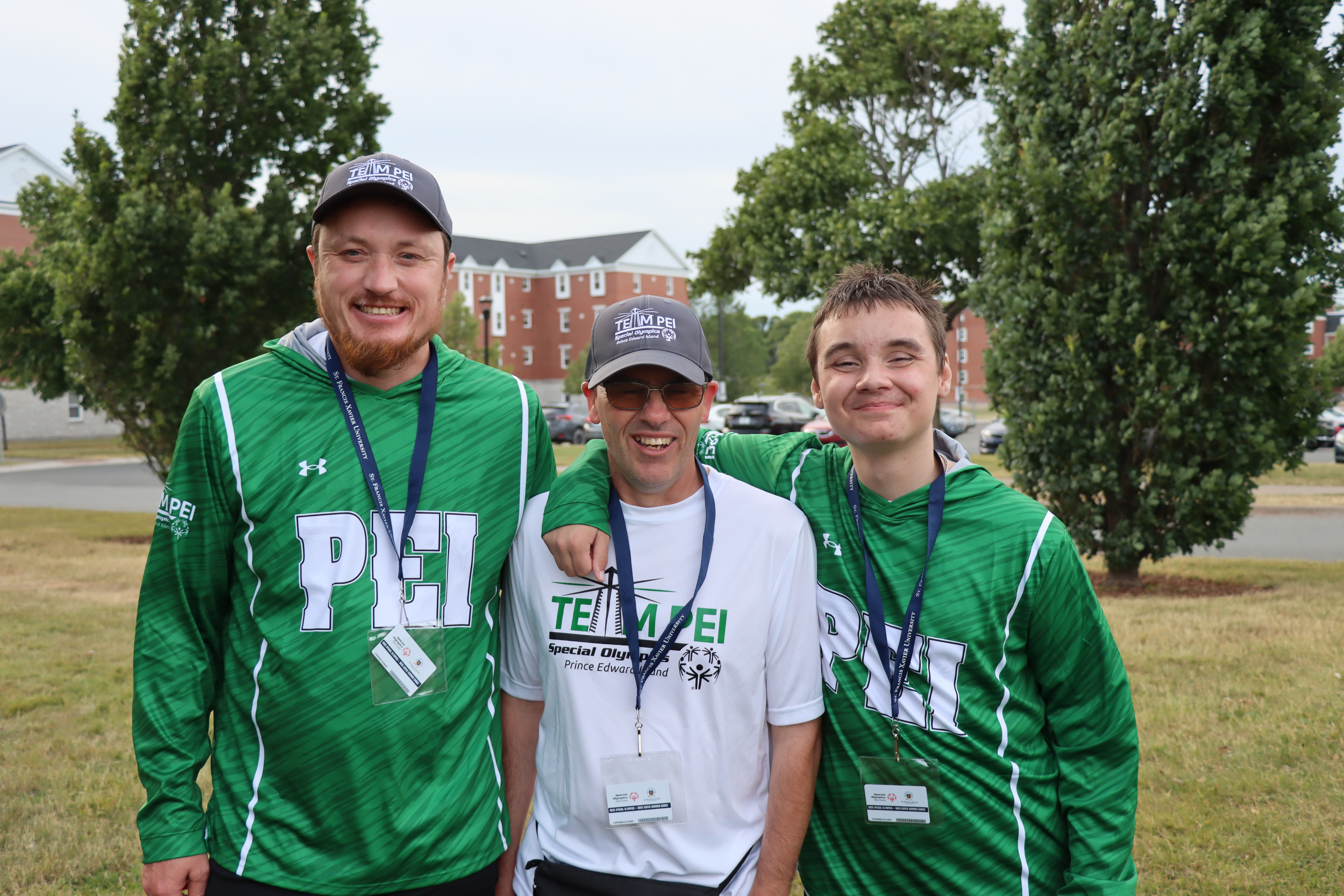 3 Team PEI athletes standing outside