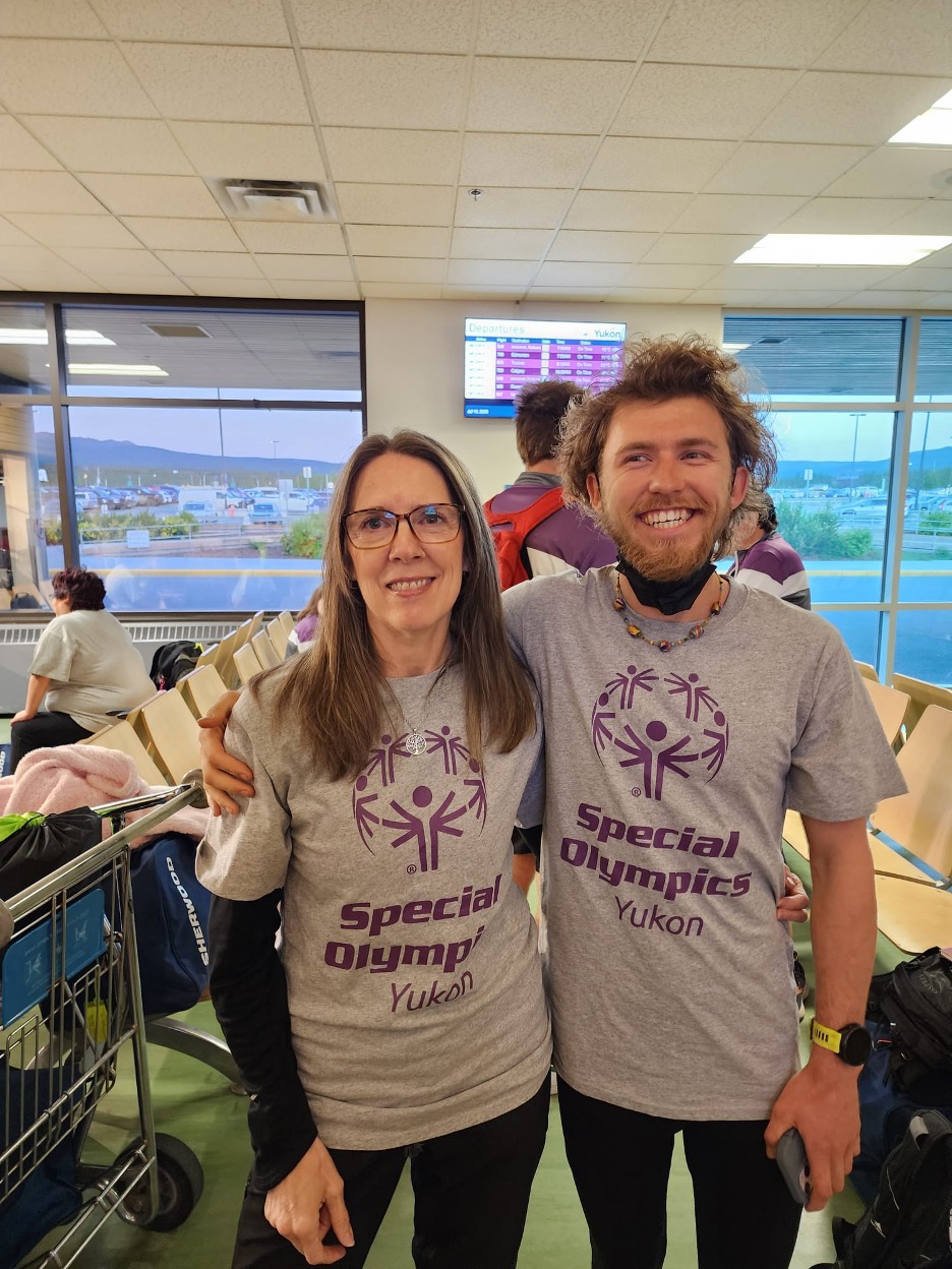 Leah Greenway stands with athlete Darby McIntyre at an indoor event. Leah Greenway stands with athlete Darby McIntyre at an indoor event.