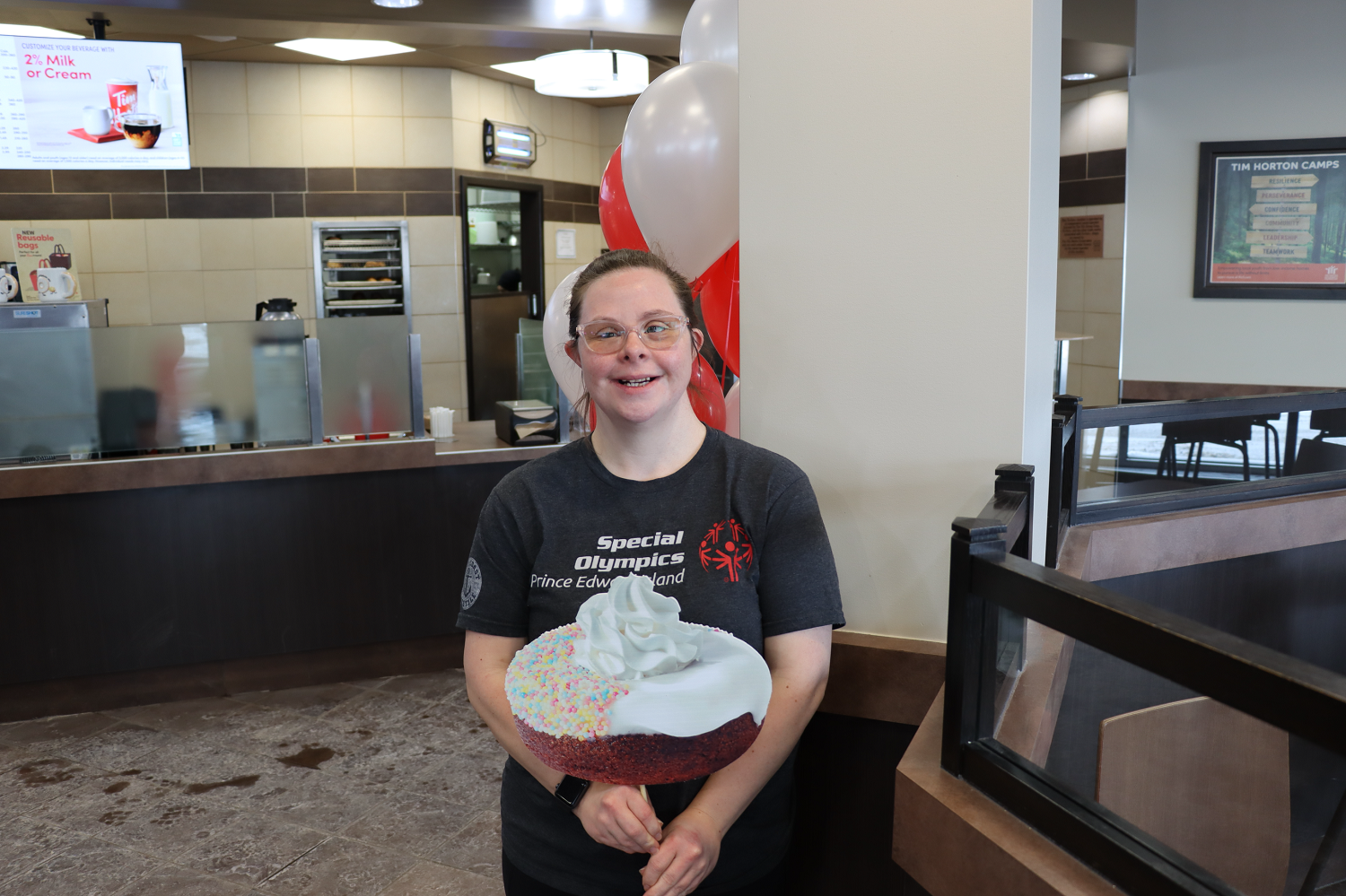 Special Olympics Donut Ambassador Callie Wood promoting the Special Olympics Donut at Tim Hortons