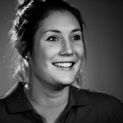 Headshot a woman smiling at the camera. Headshot a woman smiling at the camera.