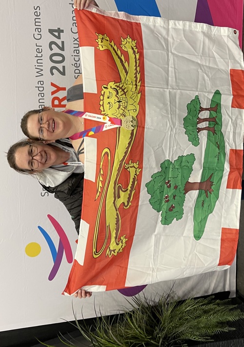 Special Olympics PEI, Team PEI 2024, Figure Skating, Athlete with Parents and PEI Flag