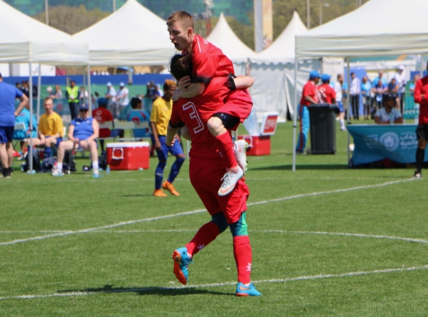 SO Team Canada soccer players celebrate their win.