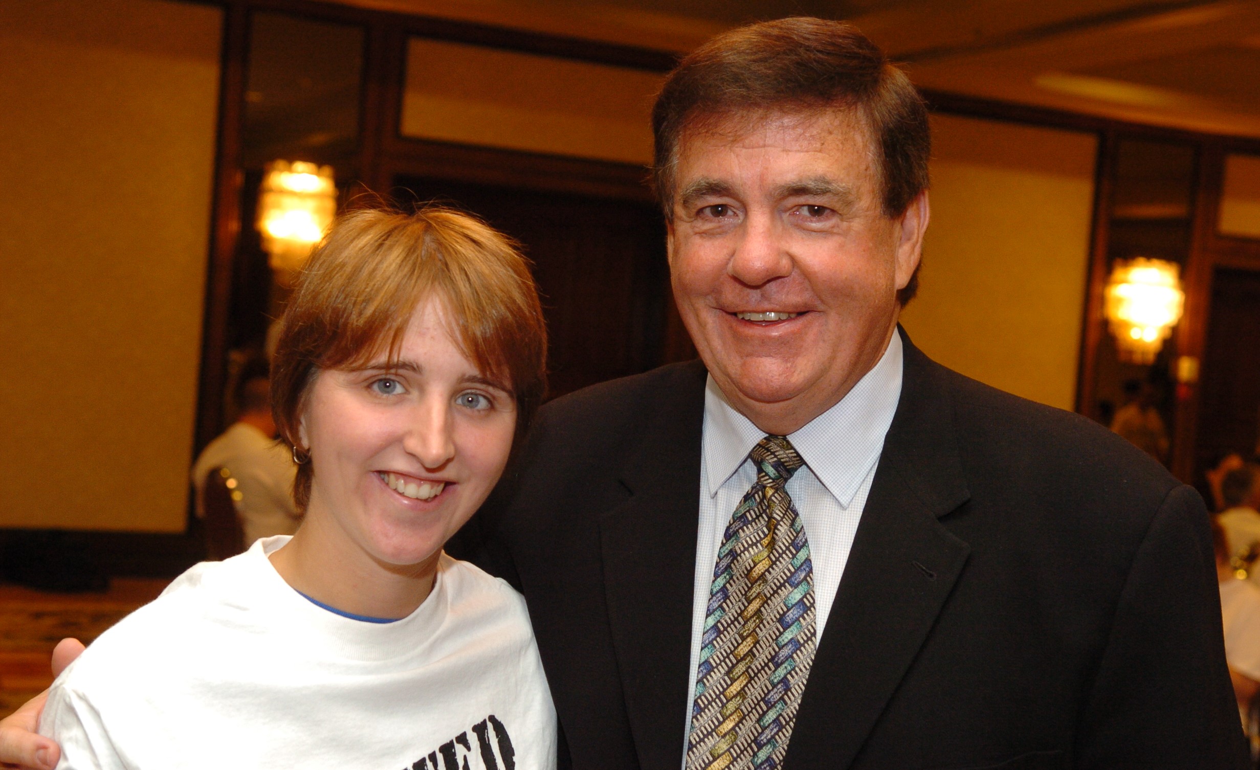 Bernie Pascall with his arms around a Special Olympics athlete at an event