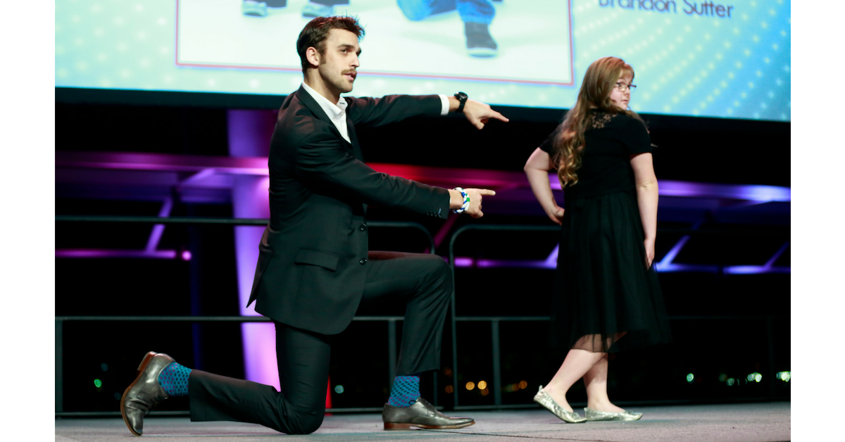 Brandon Sutter on stage with a Special Olympics athlete at Vancouver's Sports Celebrity Festival.