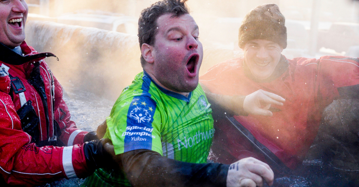 A Special Olympics athlete shouts as he participates in LETR Polar Plunge.