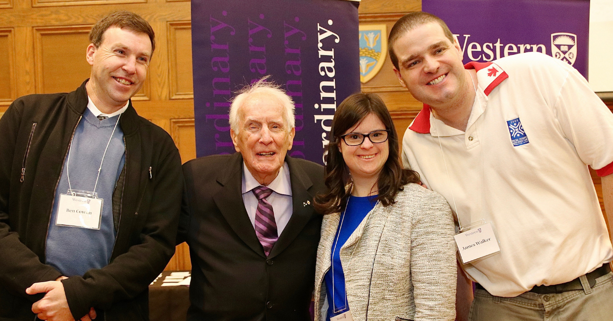 Dr. Hayden poses for a photo with Special Olympics athletes at an announcement at Western University.