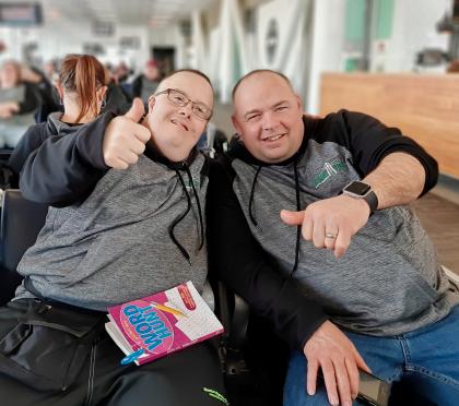 Athlete Chris MacPherson and Coach Jamie Matheson relaxing mid travel to 2020 SOC National Winter Games