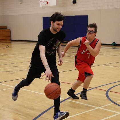 Special Olympics PEI, 2 Athletes Playing Basketball