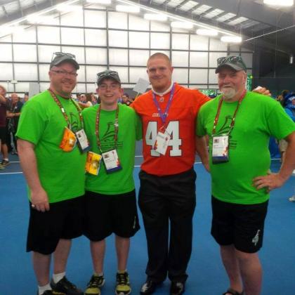 Jason, his son Jacob, Adam Bighill (now a Winnipeg Bluebomber) and his father Glen at the Special Olympics Canada Summer Games Vancouver 2014.