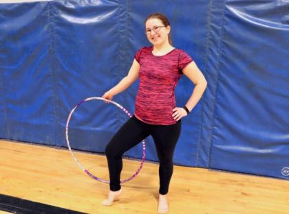 Annick Léger poses with a hoop she uses in her rhythmic gymnastics routine.