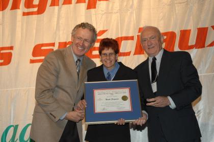 "Frank Selke Jr. presents a Special Olympics athlete with an Athlete of the Year Award