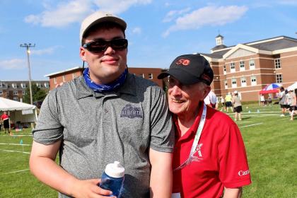 Dr. Frank Hayden with Special Olympics Alberta athlete Darby Taylor.